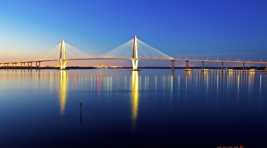 Arthur Ravenel Jr. Bridge illuminated at twilight over Charleston Harbor
