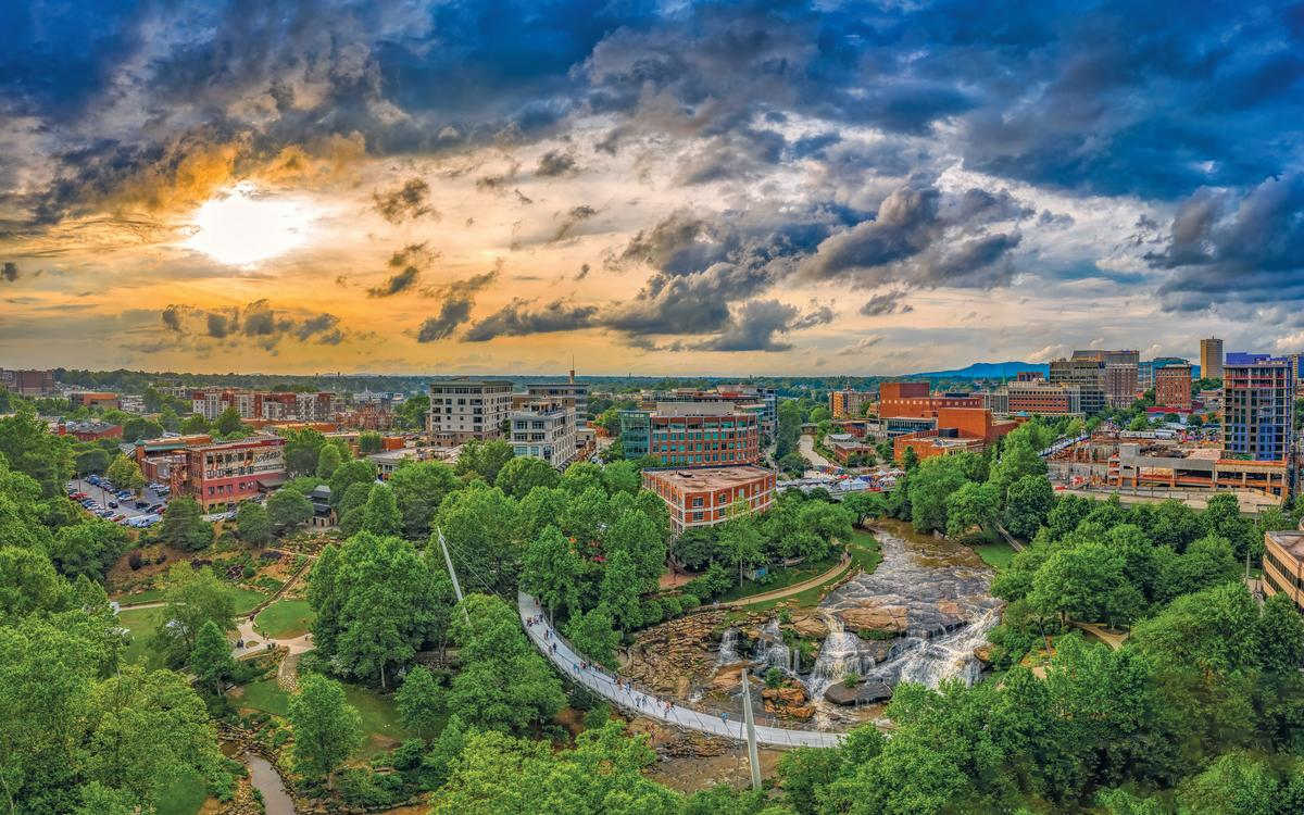 Aerial view of downtown Greenville, South Carolina with Blue Ridge Mountains