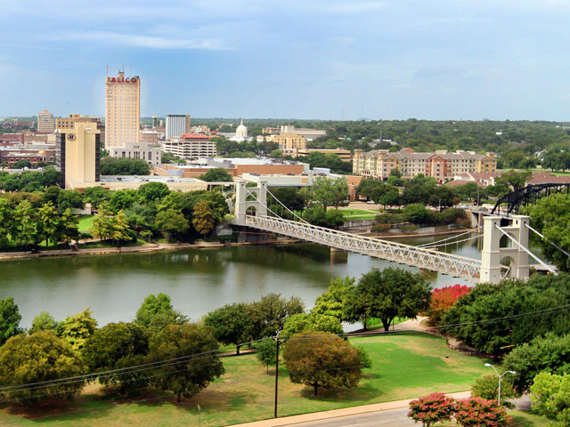Waco Texas skyline with Brazos River at sunset
